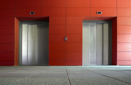 Two elevator doors in a luxurious buildingの写真素材