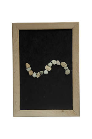 Approximately stone made on black background in frame.の写真素材