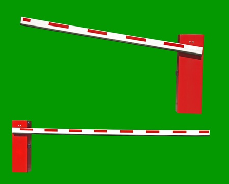 Two real closed Car Barriers isolated on white and green backgroundの写真素材