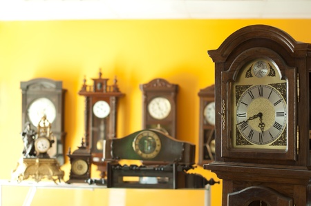 Old antique clocks close up and blurred background clocksの写真素材
