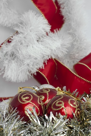 Christmas motifs with balls and chains. Red and white balls, white chains and red ribbonの写真素材
