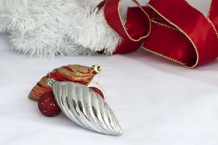Christmas motifs with balls and chains. Red and white balls, white chains and red ribbonの写真素材