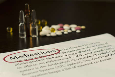 Drugs and paper with text medications.Red markedの写真素材