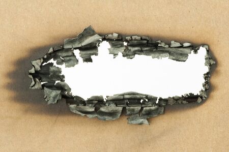 Burned paper and close up hole