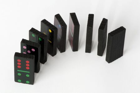 Multicolored domino pieces over white