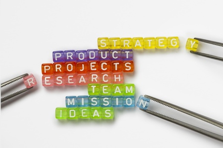 Text success, strategy,product,reserch,team and ideas on colorful wooden cubes over whiteの写真素材