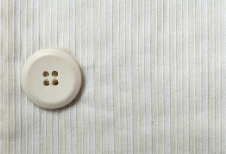 Fabric background texture and button close up の写真素材