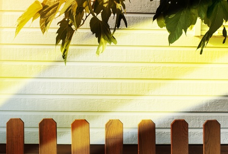 Wooden decorative fence and white wall