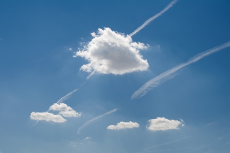 Traces of planes and clouds in the sky.