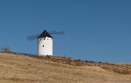 White ancient windmill. Blue sky backgroundの写真素材