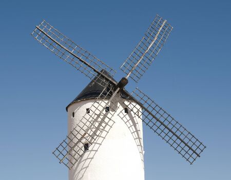 White ancient windmill. Blue sky backgroundの写真素材