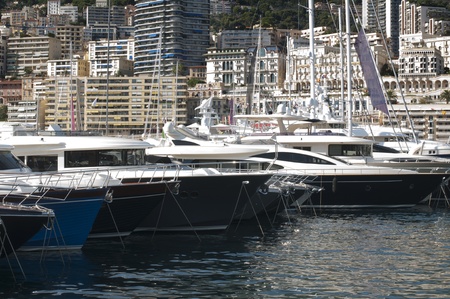 Yachts moored in Monaco. Buildings from Monaco in the background.の写真素材