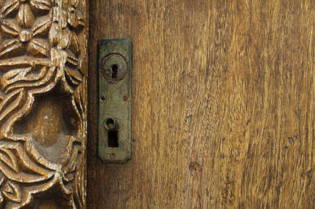 Antique ornaments on wooden doorの写真素材