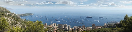 Panoramic photo of Monaco.Castle, big ship, Monte Carlo Casino and yachts in the bay.の写真素材