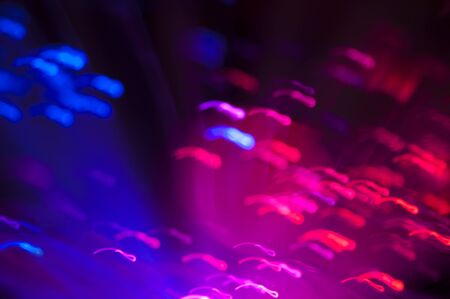 Blue and pink festive lights and circles backgroundの写真素材