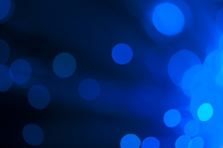 Blue and green festive lights and circles background. Blurred christmas lightsの写真素材