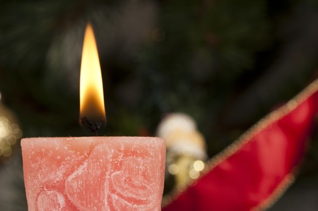 Christmas candle on the festive Christmass tableの写真素材