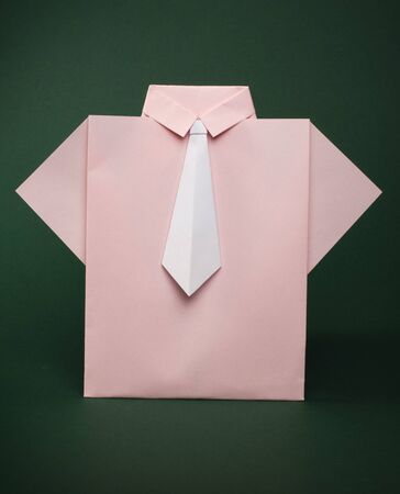 Isolated paper made pink shirt with white tie.Folded origami styleの写真素材