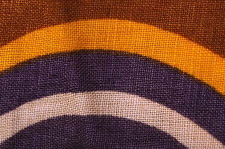 Stamped multicolored lines fabric. Natural linen fabric.Violet, orange, pink and brown clors