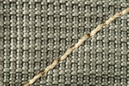 Green textile background with seams