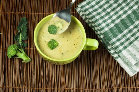 Green Cream broccoli soup Vegetables around the bowlの写真素材