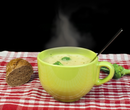 Green Cream broccoli steaming soup Vegetables around the bowlの写真素材