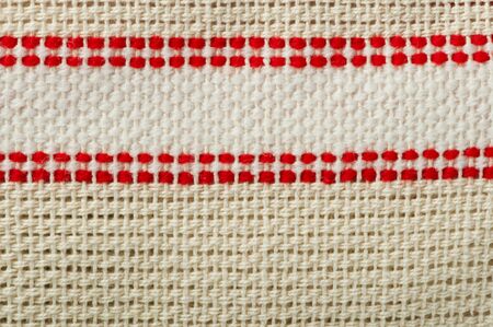 Cotton textile background. Beige closeup textile texture.