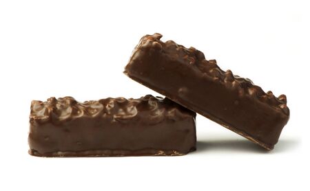 Small waffles with chocolate glaze and nuts. White isolatedの写真素材