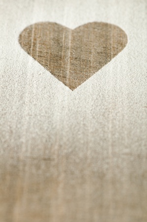 Heart pattern on an old wooden board. Heart made of sugarの写真素材