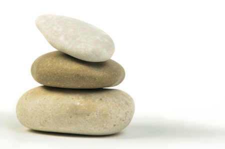 Stacked stones white isolated. Studio shot .
