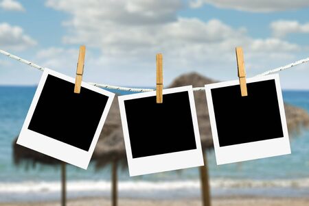 Pictures template hooked on a rope. Sky backgroundの写真素材