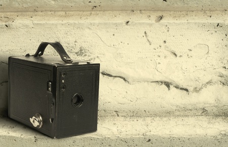 Old vintage camera stone wall backgroundの写真素材