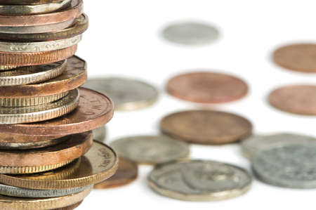 Stacks of coins white isolated studio shot