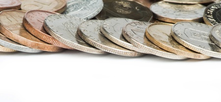 Stacks of coins white isolated studio shotの写真素材