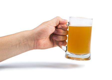 Hand holding bottle of beer and beer mug. White isolated studio shot.の写真素材
