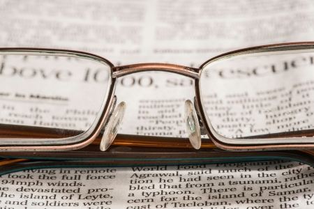 Glasses on newspaper. Natural lightingsの写真素材