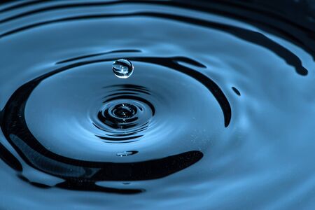 Waterdrops in darkness. Close up macro shot