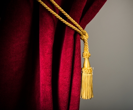 Red velvet curtain with tassel. Close upの写真素材