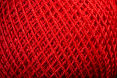 Red yarn close up background