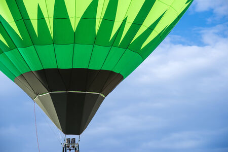 Green Balloon on blue skyの写真素材