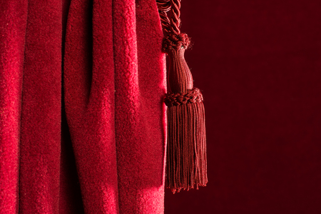 Red theatre curtain and red tasselsの写真素材