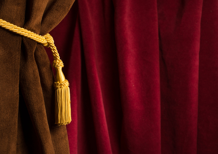 Red theatre curtain and yellow tassels