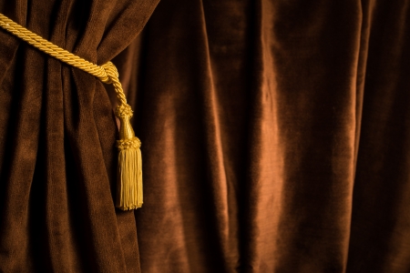 Brown theatre curtain and yellow tasselsの写真素材