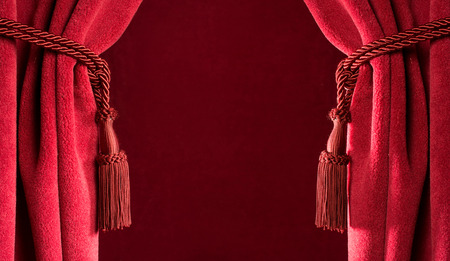 Red theatre curtains and red tasselsの写真素材