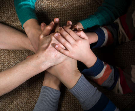 Many hands together. Interior shotの写真素材