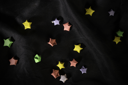 Multicolor small origami stars on back satin