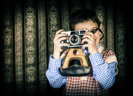 Boy with vintage camera. Vintage clothesの写真素材