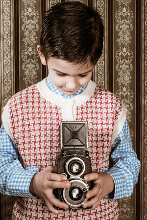 Boy with vintage camera. Vintage clothesの写真素材