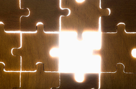 Wooden puzzle and backlight background. Close upの写真素材