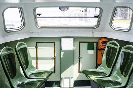 Sits in small passenger ship. Close upのeditorial素材